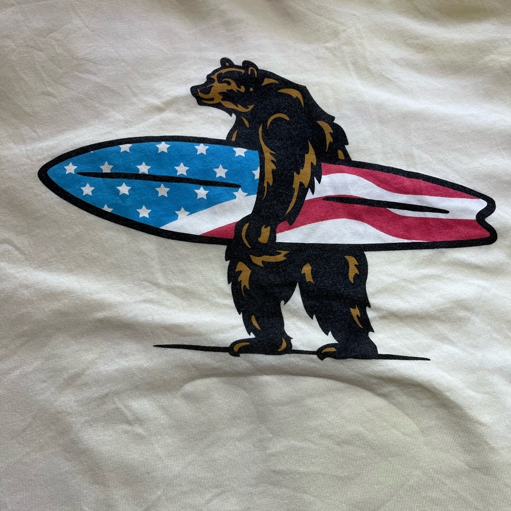 Men's White Short Sleeve Tee with Bear Carrying American Surfboard Graphic by
